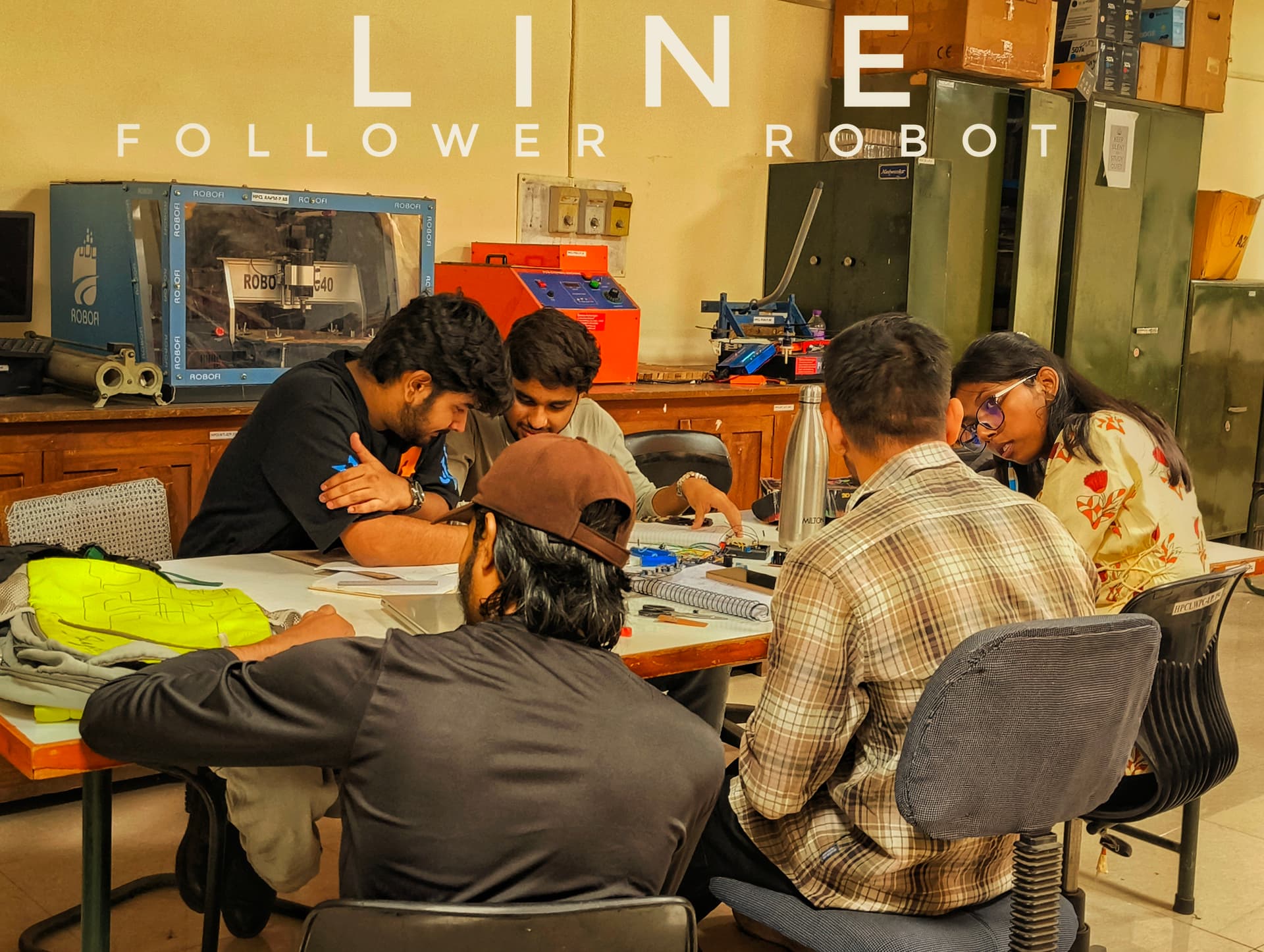 VyomikX engineering team collaborating on Line Follower 2 development in the lab