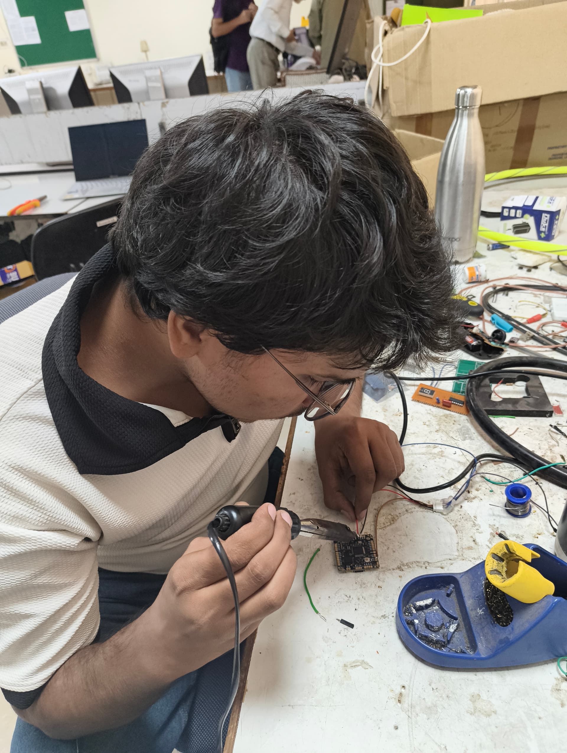Workbench soldering of flight controller power distribution and signal leads