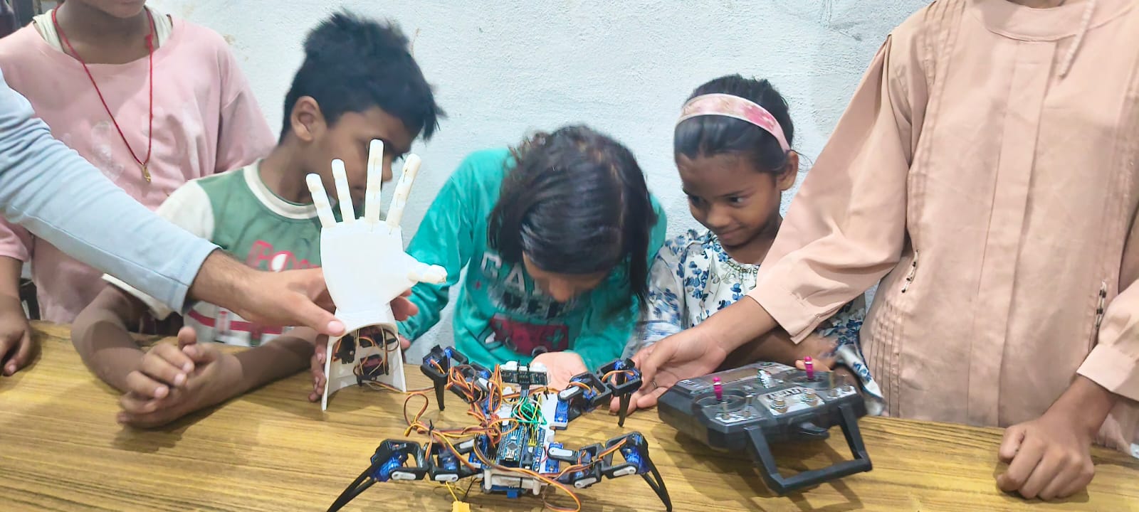 Students participating in an interactive technology and robotics learning activity